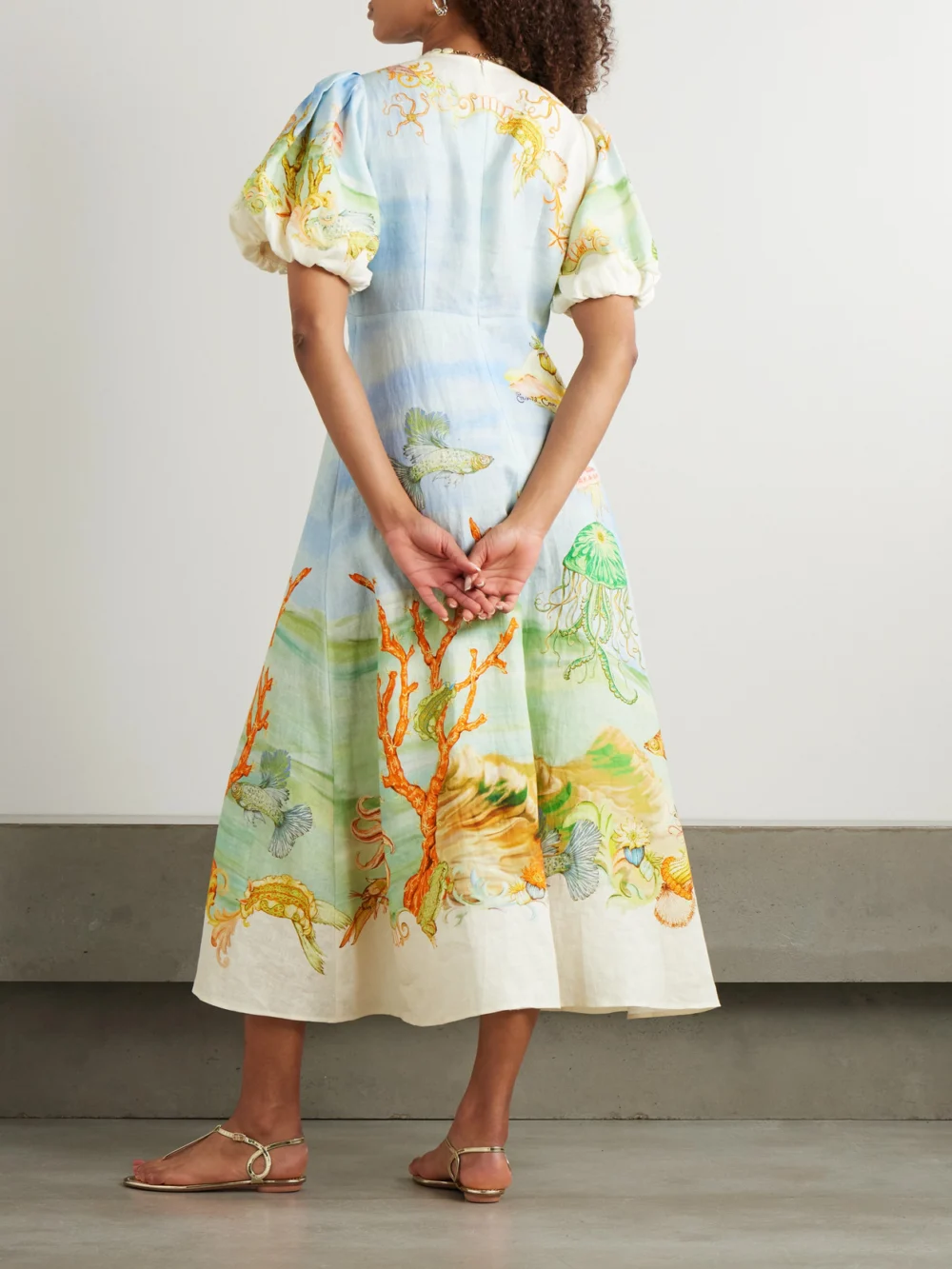 Back view of the Alémais + Sam Pauletto Emerald Cove Gathered Printed Linen-gauze Midi Dress