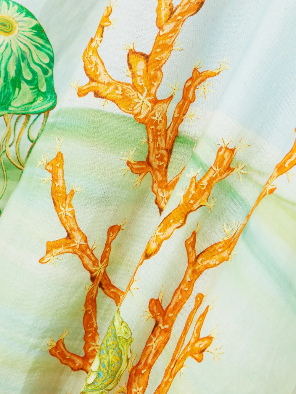 Close-up detail of the Alémais + Sam Pauletto Emerald Cove Gathered Printed Linen-gauze Midi Dress