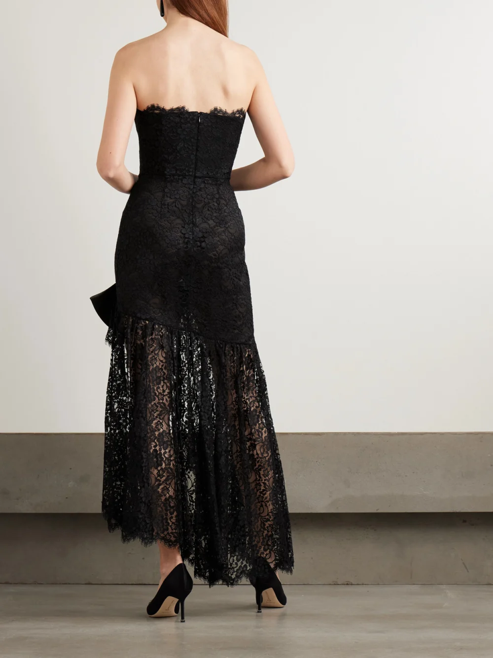 Back view of the Alessandra Rich Bow-detailed Strapless Asymmetric Silk-lace Dress