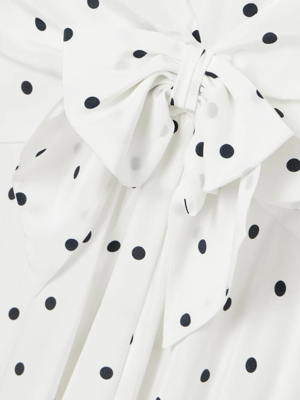 Close-up detail of the Alessandra Rich Bow-embellished Gathered Polka-dot Silk-georgette Midi Dress