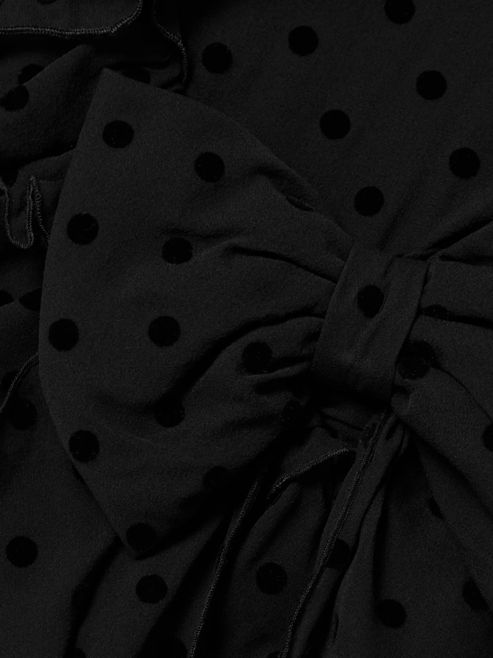 Close-up detail of the Alessandra Rich Bow-embellished Ruffled Flocked Silk-chiffon Mini Dress