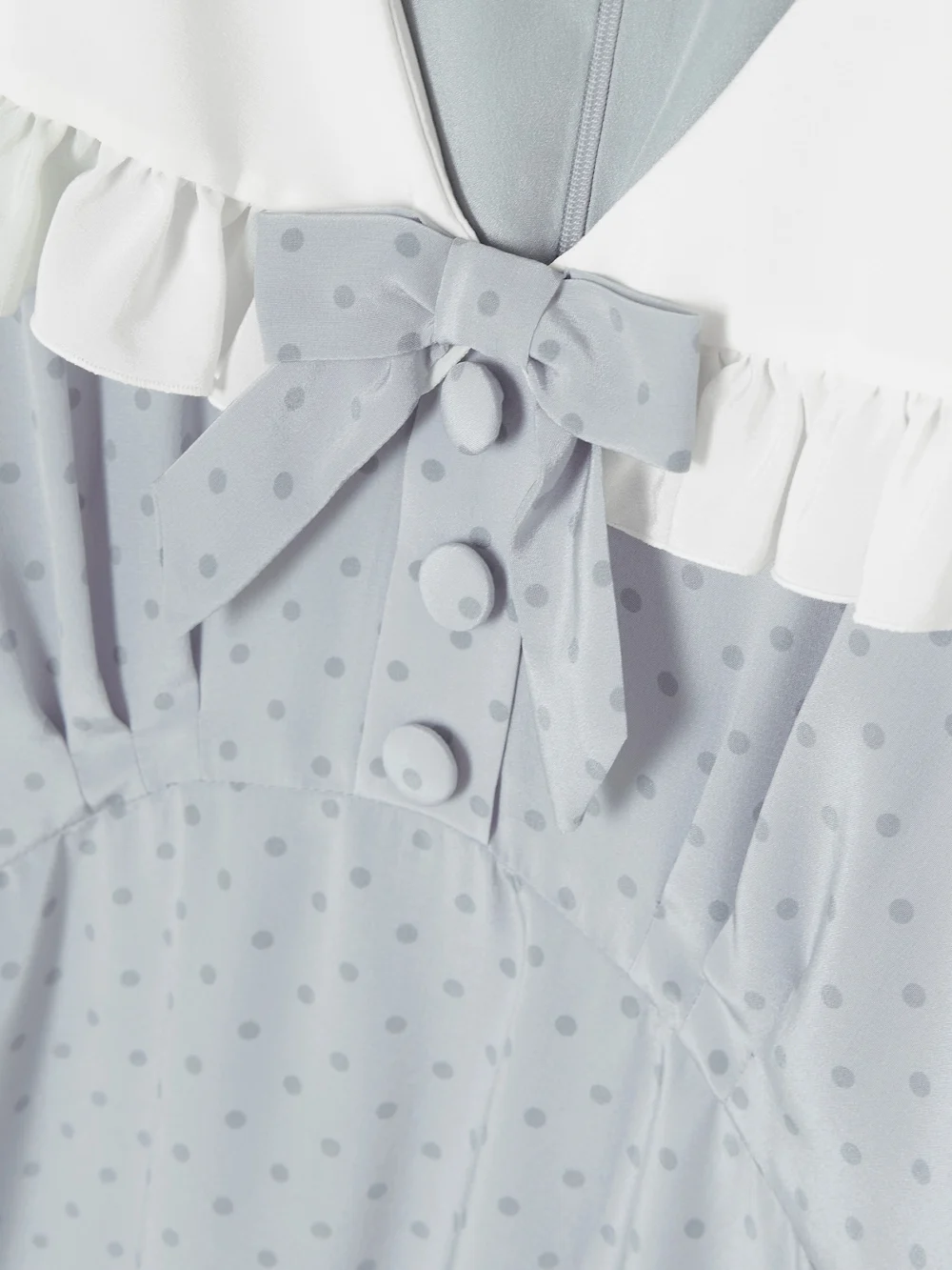 Close-up detail of the Alessandra Rich Bow-embellished Ruffled Polka-dot Silk Crepe De Chine Midi Dress