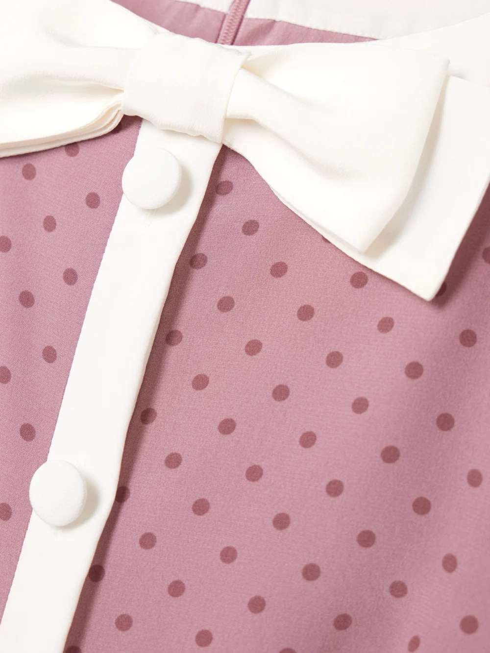 Close-up detail of the Alessandra Rich Clover Bow-detailed Polka-dot Silk Mini Dress
