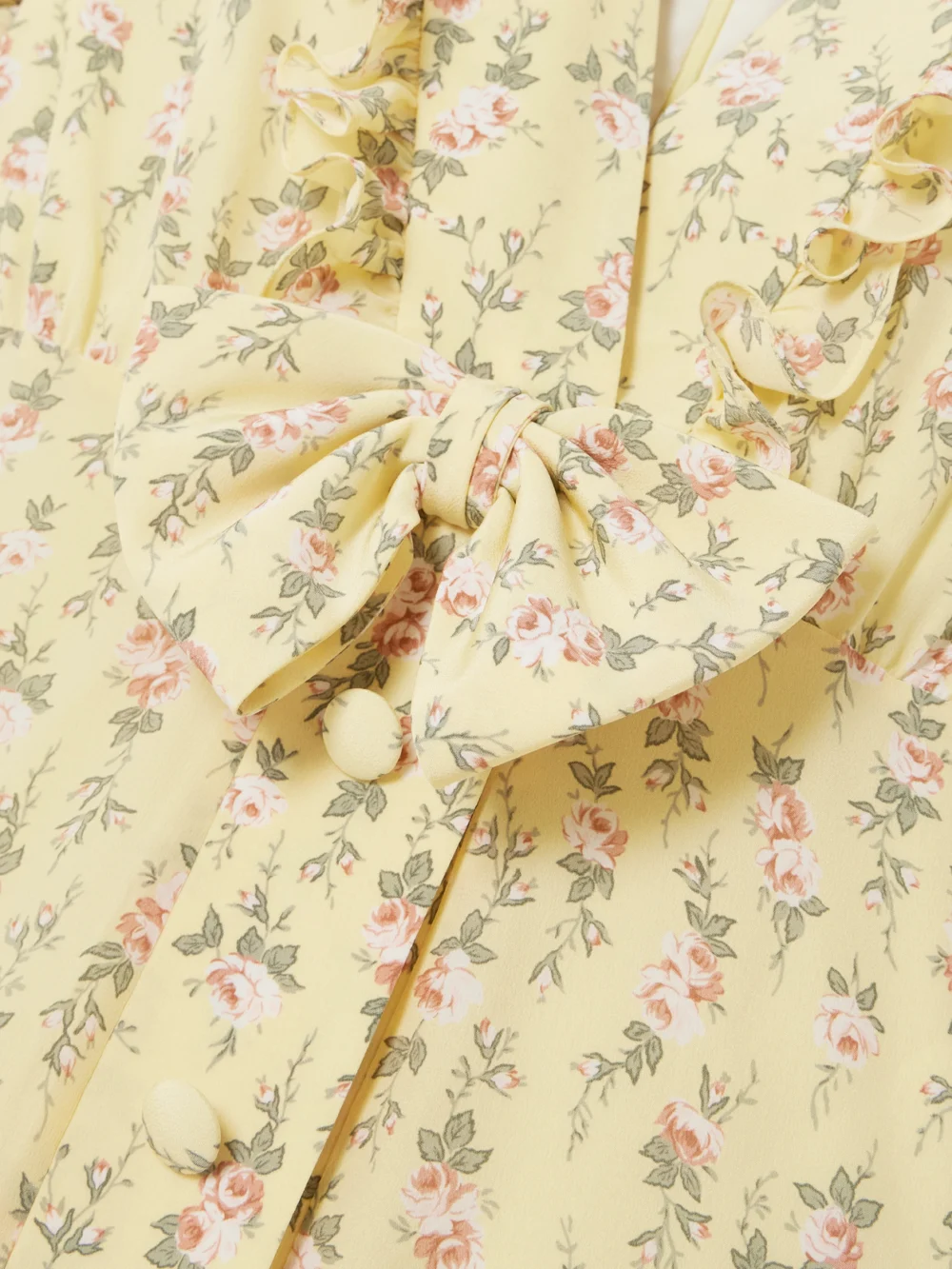 Close-up detail of the Alessandra Rich Garden Party Bow-detailed Floral-print Silk Crepe De Chine Midi Dress