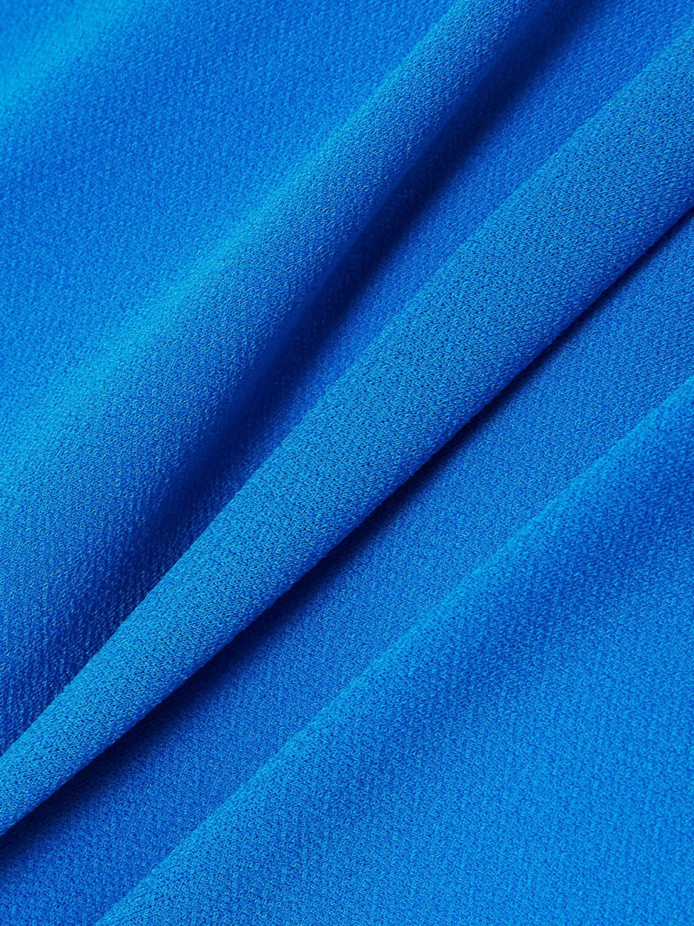 Close-up detail of the Alex Perry One-sleeve Ruched Stretch Recycled Crepe-jersey Mini Dress