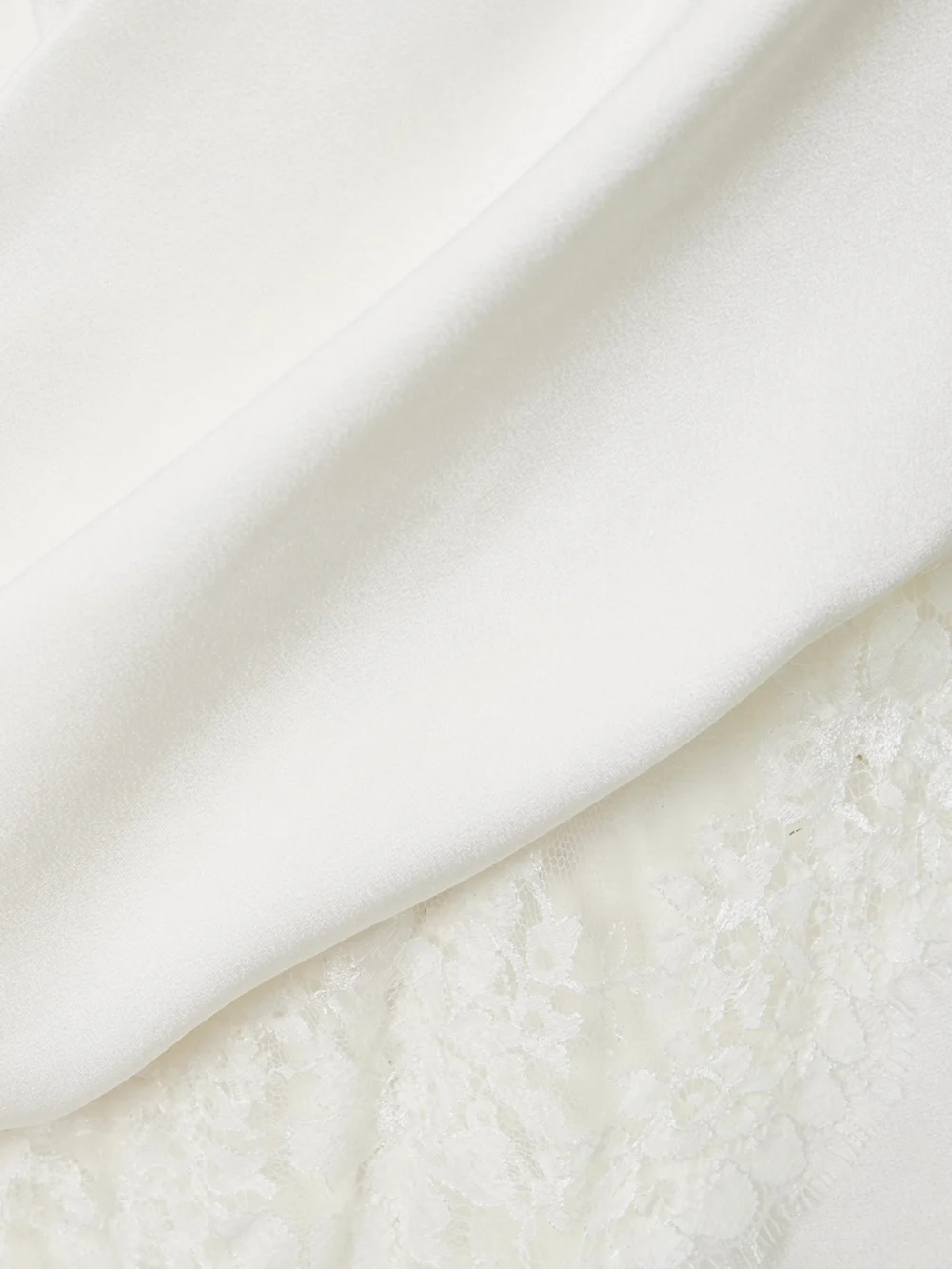 Close-up detail of the Alex Perry Wrap-effect Lace-trimmed Draped Satin-crepe Dress