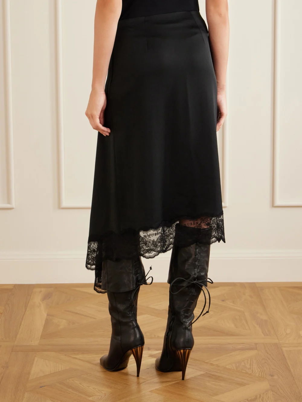 Back view of the Alexander McQueen Asymmetric Draped Lace-trimmed Crepe Midi Skirt