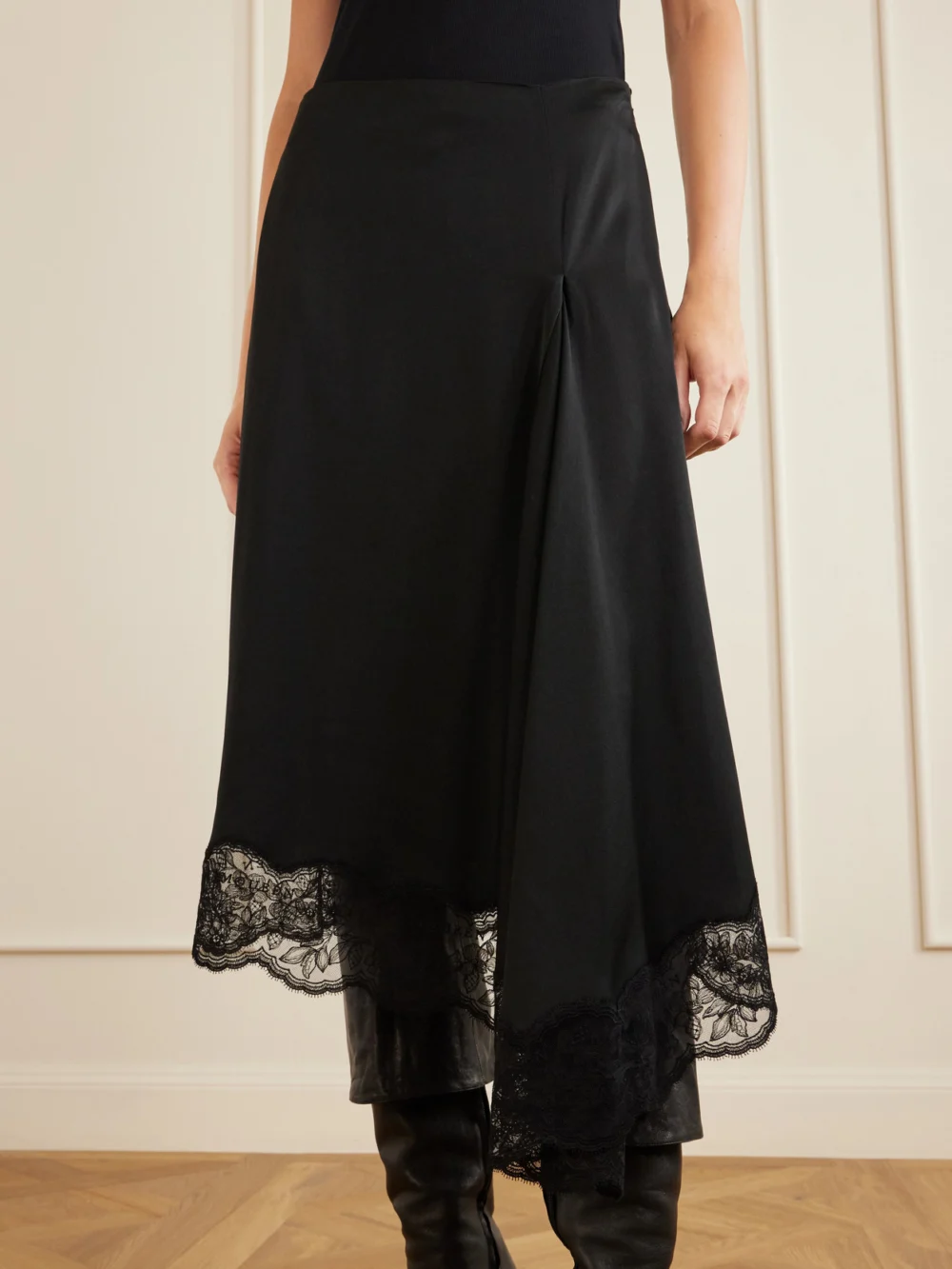 Close-up detail of the Alexander McQueen Asymmetric Draped Lace-trimmed Crepe Midi Skirt