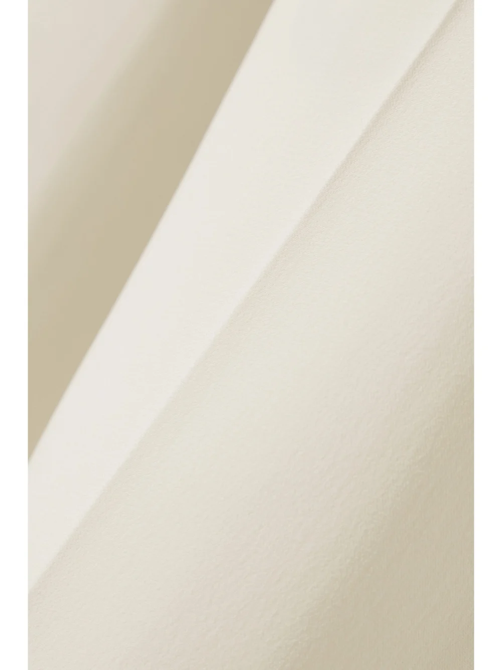 Close-up detail of the Alexander McQueen Crepe Bootcut Pants
