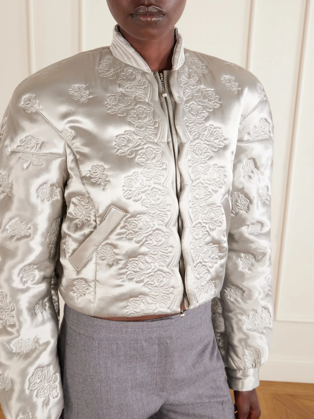 Close-up detail of the Alexander McQueen Cropped Padded Floral-embroidered Satin Jacket