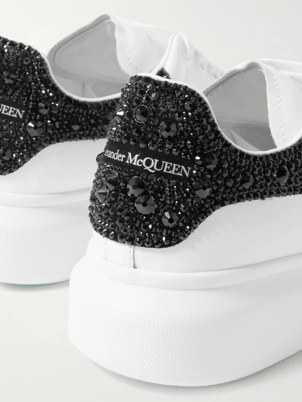 Close-up detail of the Alexander McQueen Crystal-embellished Leather Exaggerated-sole Sneakers