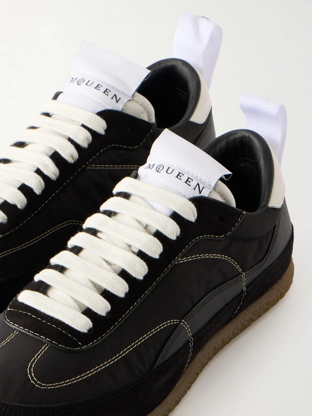 Close-up detail of the Alexander McQueen Ec1 Suede and Leather-trimmed Shell Sneakers