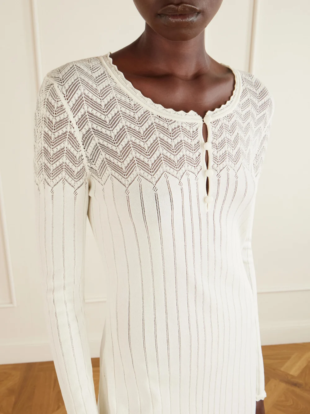 Close-up detail of the Alexander McQueen Embroidered Ribbed-knit Dress