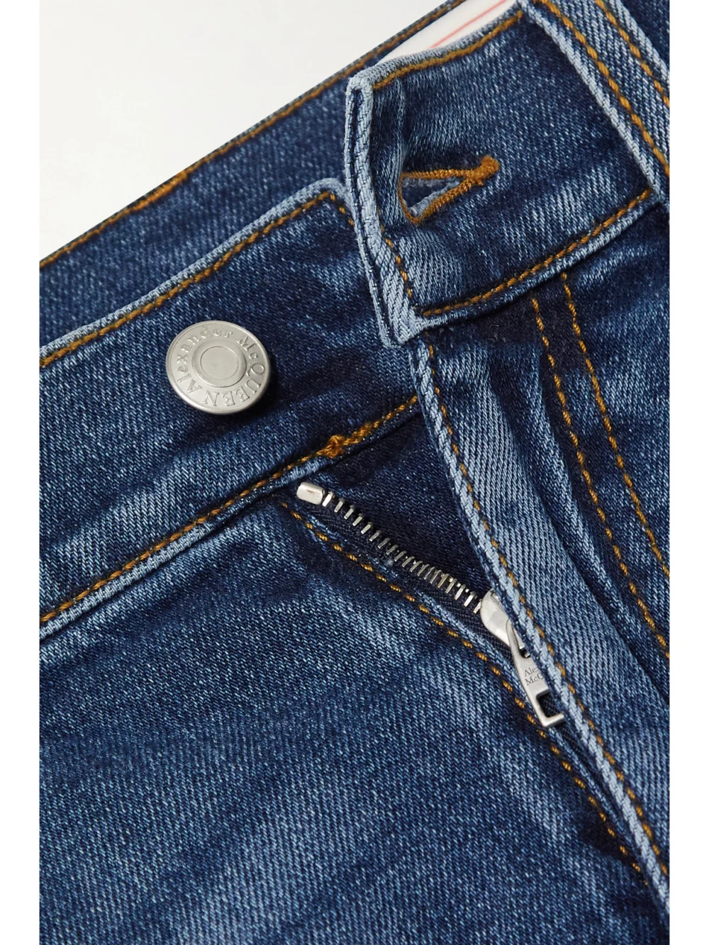 Close-up detail of the Alexander McQueen High-rise Flared Jeans