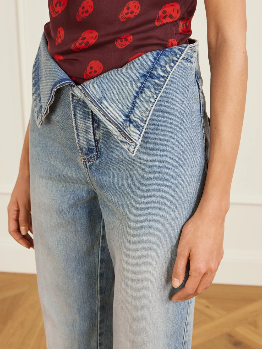 Close-up detail of the Alexander McQueen High-rise Flared Jeans