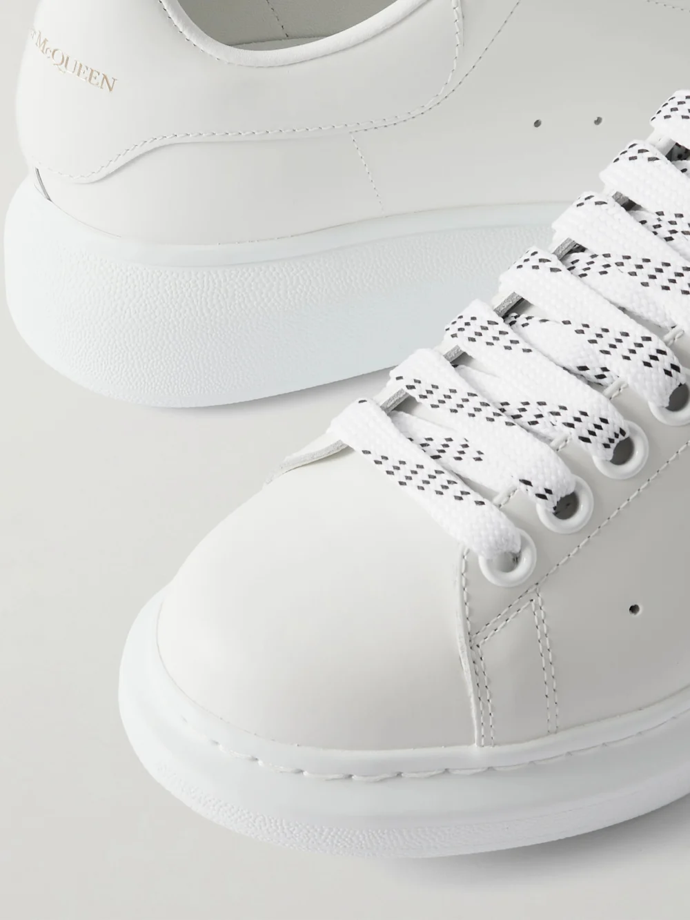 Close-up detail of the Alexander McQueen Leather Exaggerated-sole Sneakers