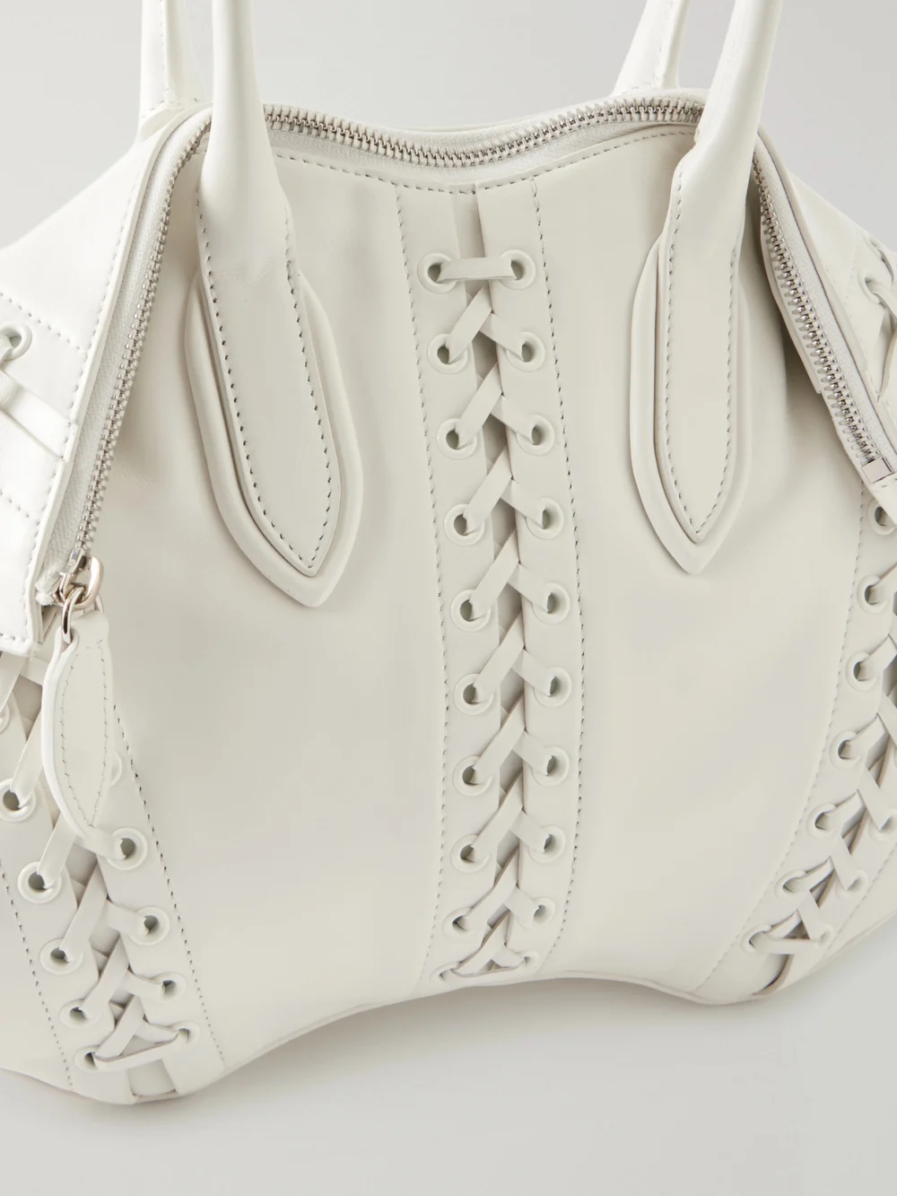 Close-up detail of the Alexander McQueen Manta Tie-detailed Leather Shoulder Bag