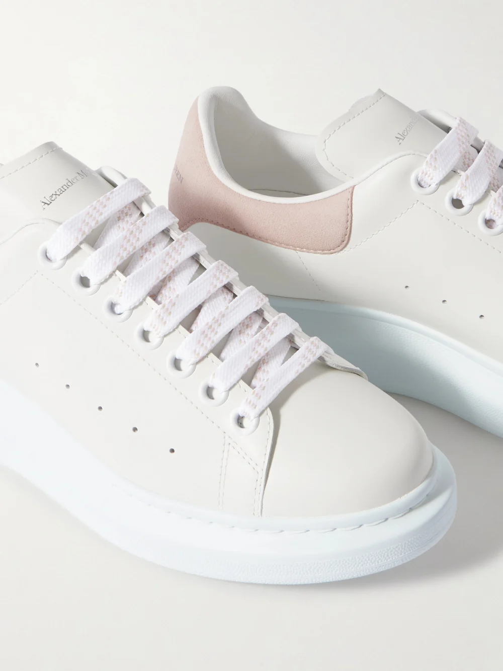 Close-up detail of the Alexander McQueen Oversize-sole Suede-trimmed Leather Sneakers