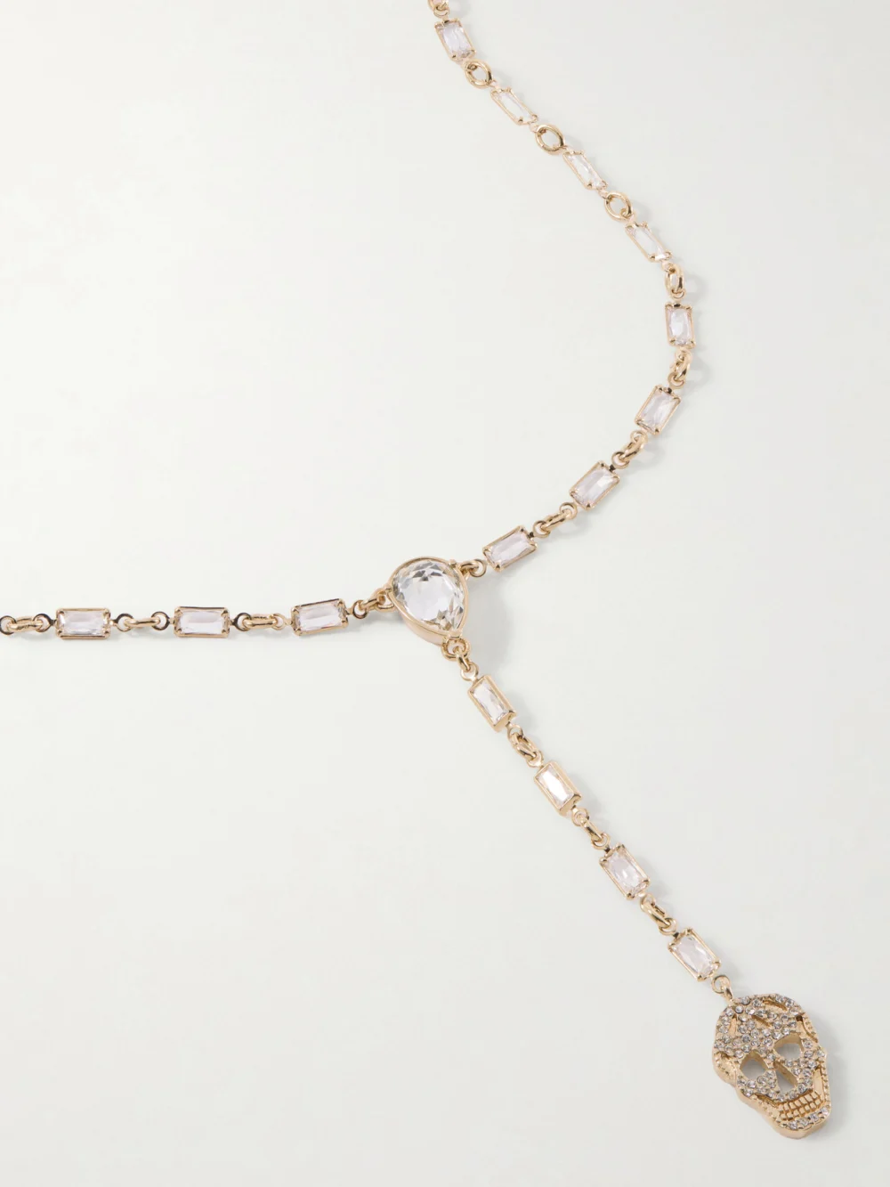 Close-up detail of the Alexander McQueen Pavé Skull Crystal-embellished Gold-tone Cubic Zirconia Necklace
