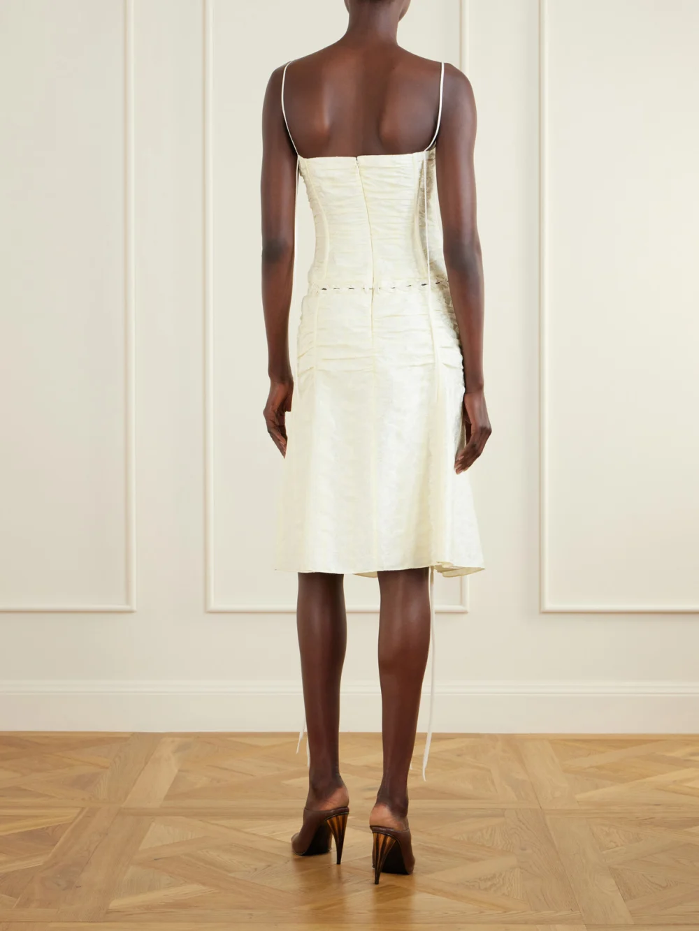 Back view of the Alexander McQueen Pleated Paneled Satin Brocade Midi Dress
