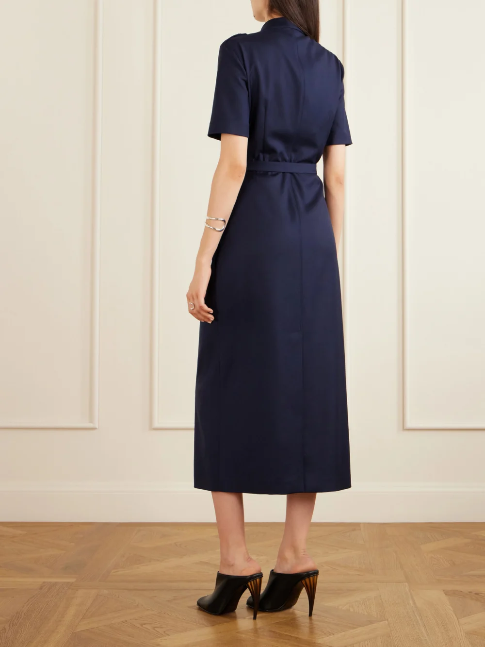Back view of the Alexander McQueen Police Belted Pleated Midi Dress