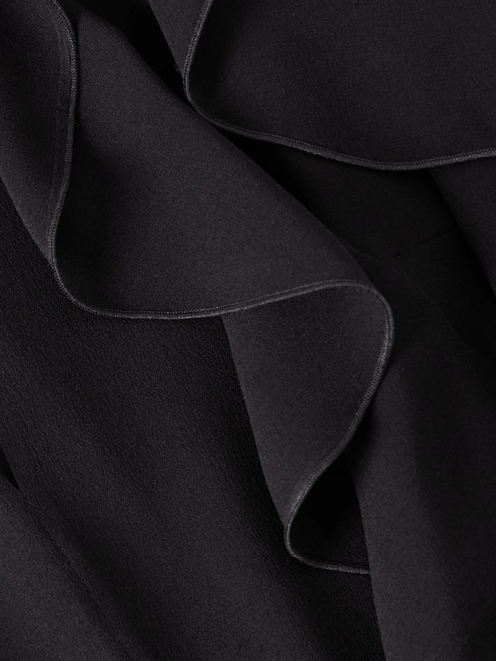 Close-up detail of the Alexander McQueen Ruffled Cutout Silk-georgette Top