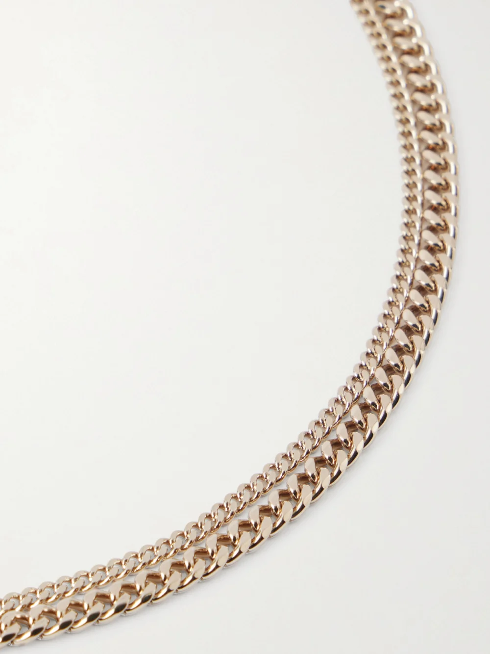 Close-up detail of the Alexander McQueen Skull Gold-tone, Crystal and Pearl-like Necklace