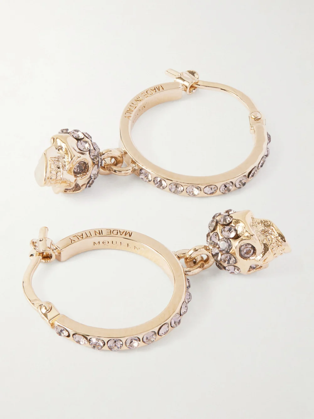 Close-up detail of the Alexander McQueen Skull Mini Creole Gold Plated Hoop Earrings