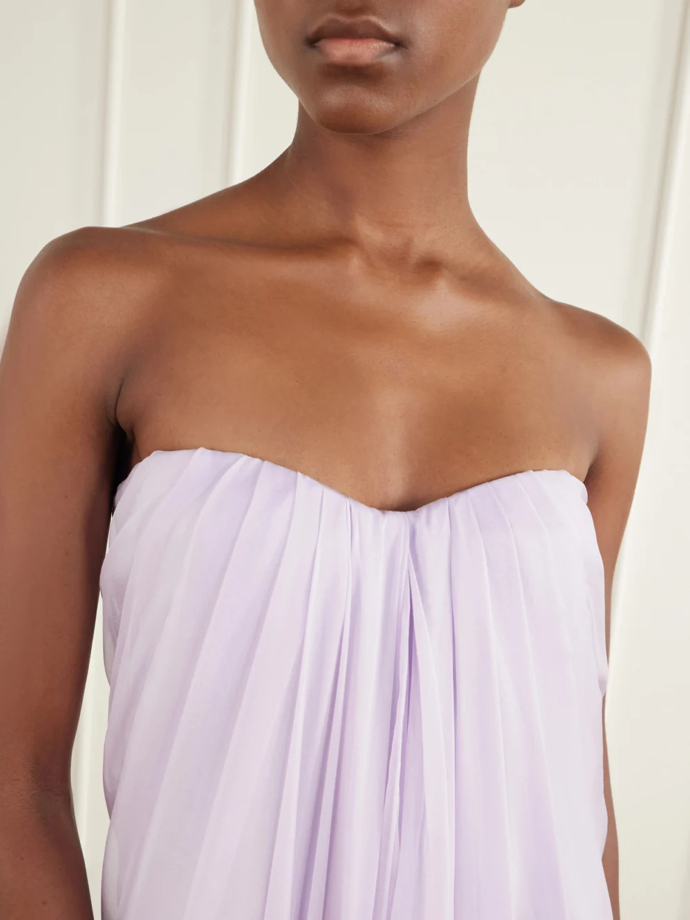 Close-up detail of the Alexander McQueen Strapless Draped Silk Bustier Maxi Dress