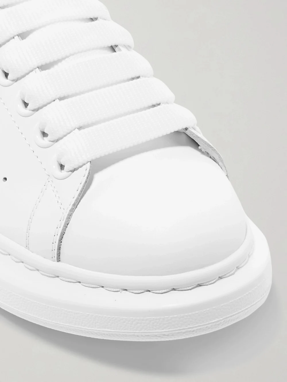 Close-up detail of the Alexander McQueen Suede-trimmed Leather Exaggerated-sole Sneakers