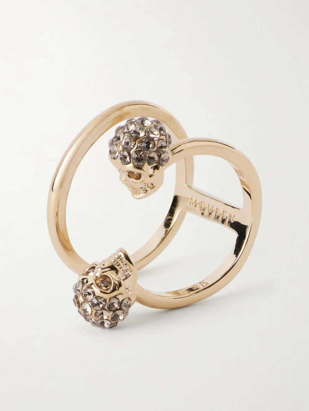 Close-up detail of the Alexander McQueen Win Skull Gold Plated Double Ring