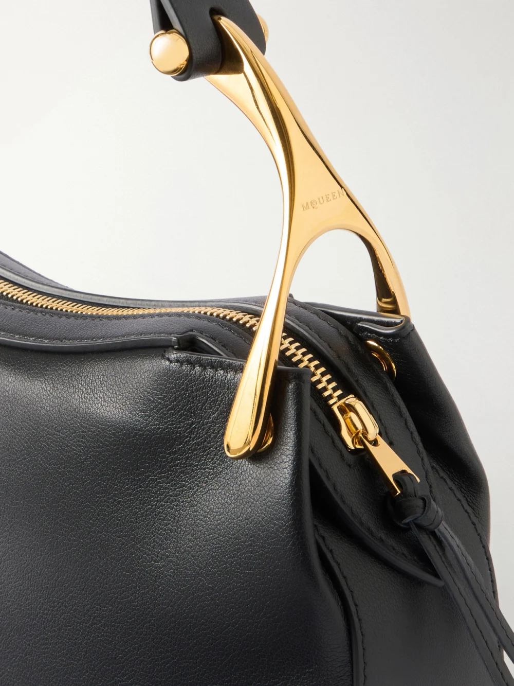 Close-up detail of the Alexander McQueen Wishbone Braided Leather Shoulder Bag