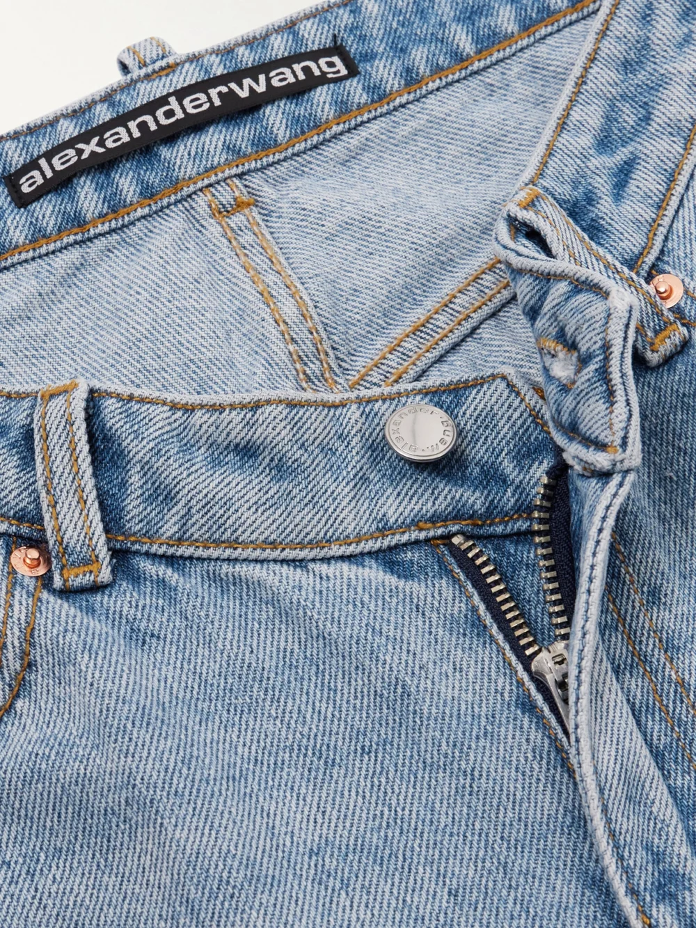 Close-up detail of the Alexander Wang Nameplate Embellished Mid-rise Straight-leg Jeans