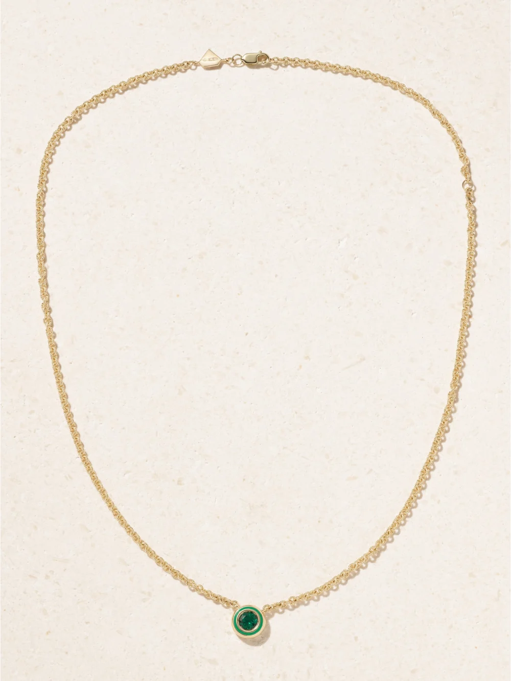 Close-up detail of the Alison Lou Madison 14-karat Gold, Emerald and Enamel Necklace
