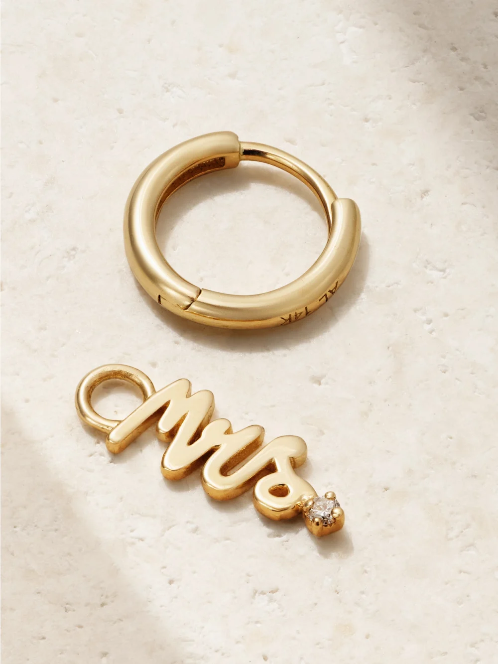 Close-up detail of the Alison Lou Mrs 14-karat Gold Diamond Single Hoop Earring