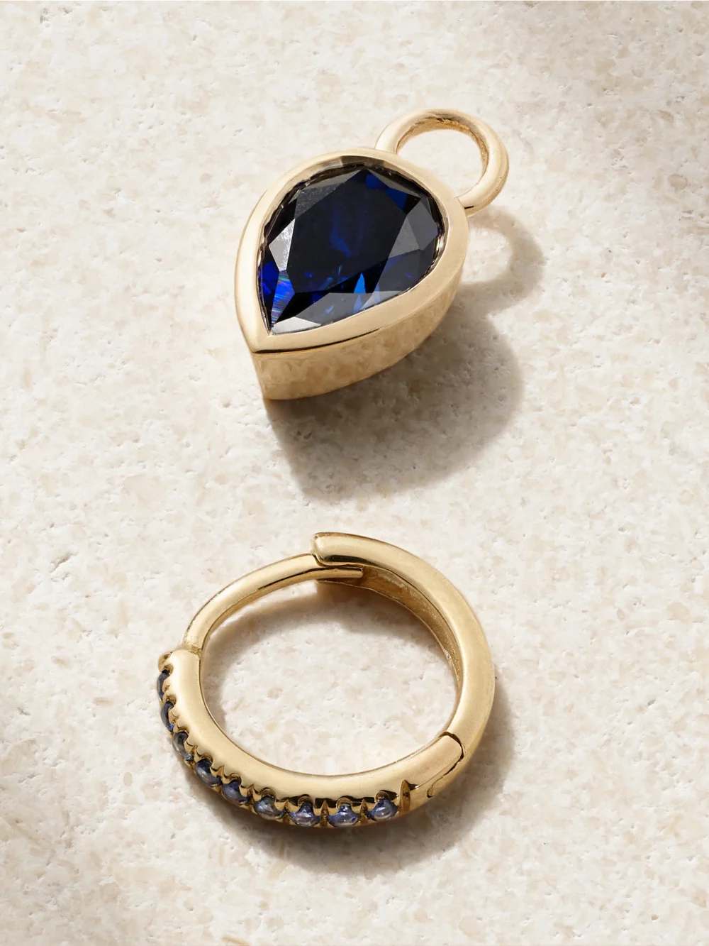Close-up detail of the Alison Lou Tear 14-karat Gold, Sapphire and Laboratory-grown Sapphire Single Hoop Earring