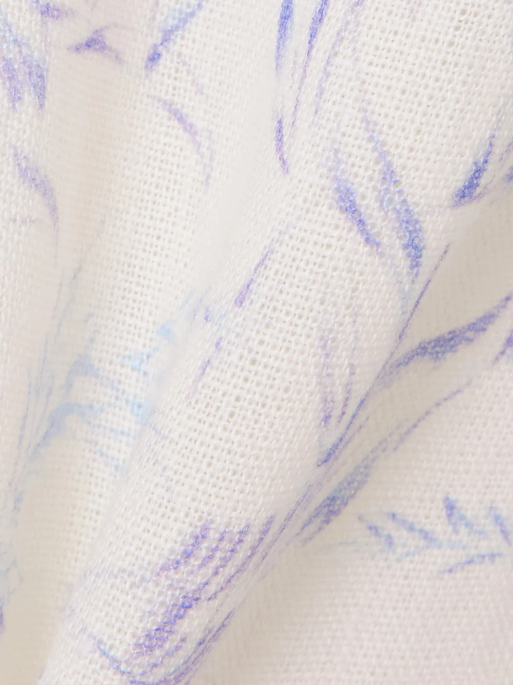 Close-up detail of the Alix Of Bohemia Bunny Avian Printed Linen-canvas Flared Pants