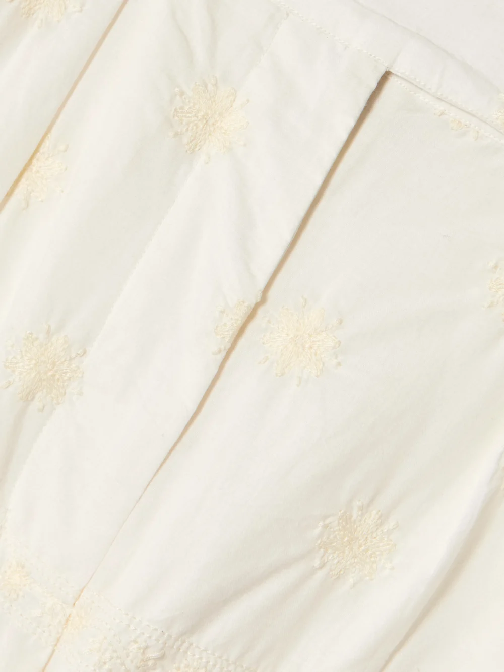 Close-up detail of the Alix Of Bohemia Deena Pleated Embroidered Cotton-voile Shorts