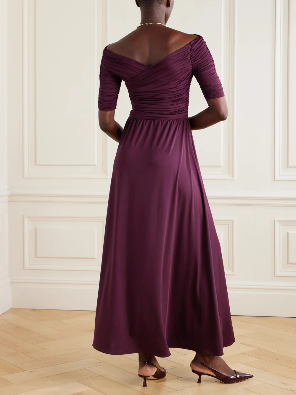 Back view of the Altuzarra Char Ruched Wrap-effect Recycled Stretch-jersey Maxi Dress