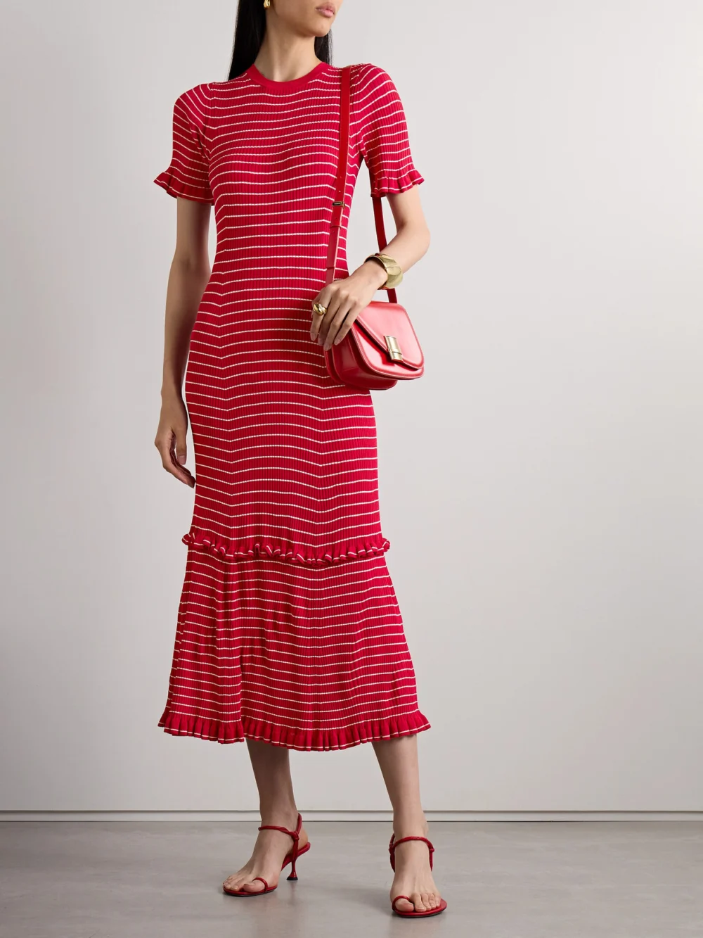 Altuzarra Delpini Ruffled Striped Ribbed-knit Midi Dress, worn by a model