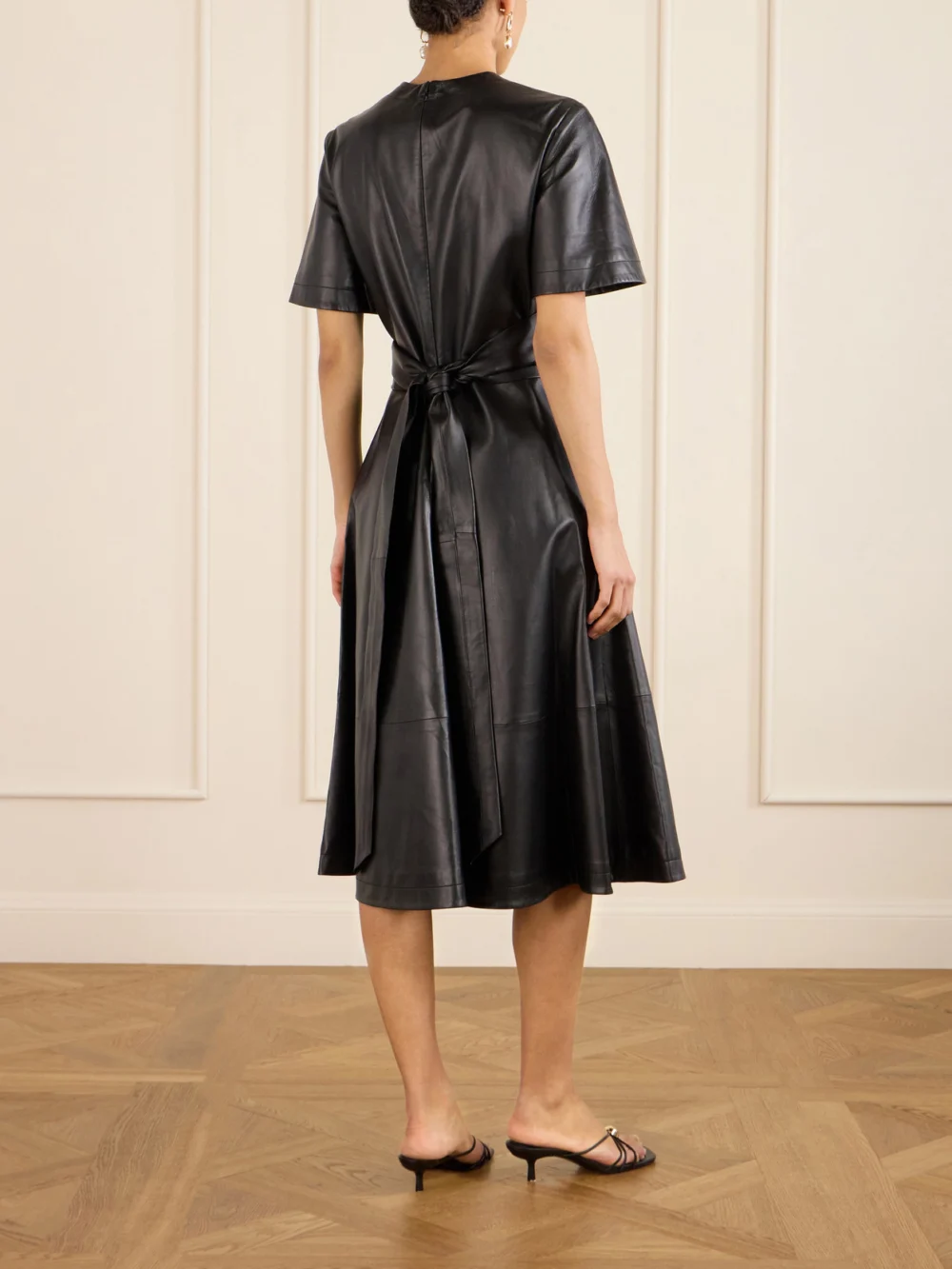 Back view of the Altuzarra Kirsty Wrap-effect Paneled Leather Midi Dress