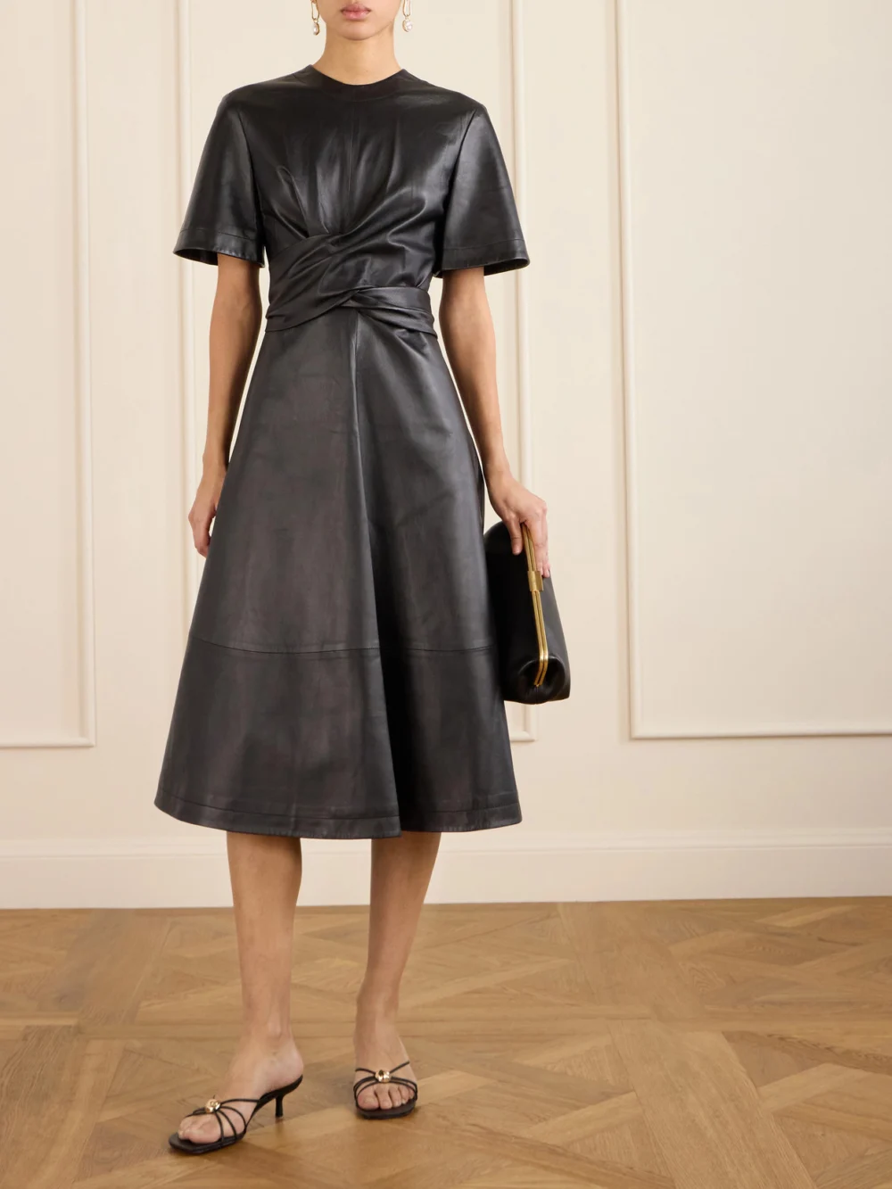 Altuzarra Kirsty Wrap-effect Paneled Leather Midi Dress, worn by a model