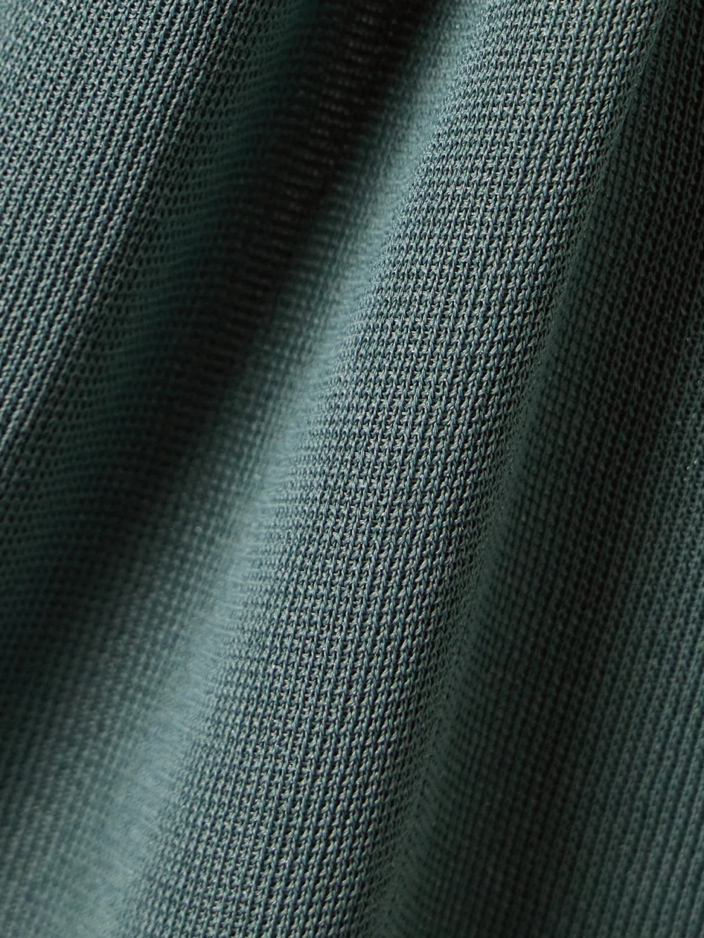Close-up detail of the Altuzarra Maisie Gathered Metallic Stretch-knit Maxi Dress