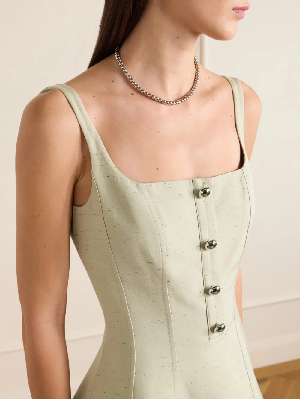 Close-up detail of the Altuzarra Orrie Button-embellished Cotton-blend Midi Dress