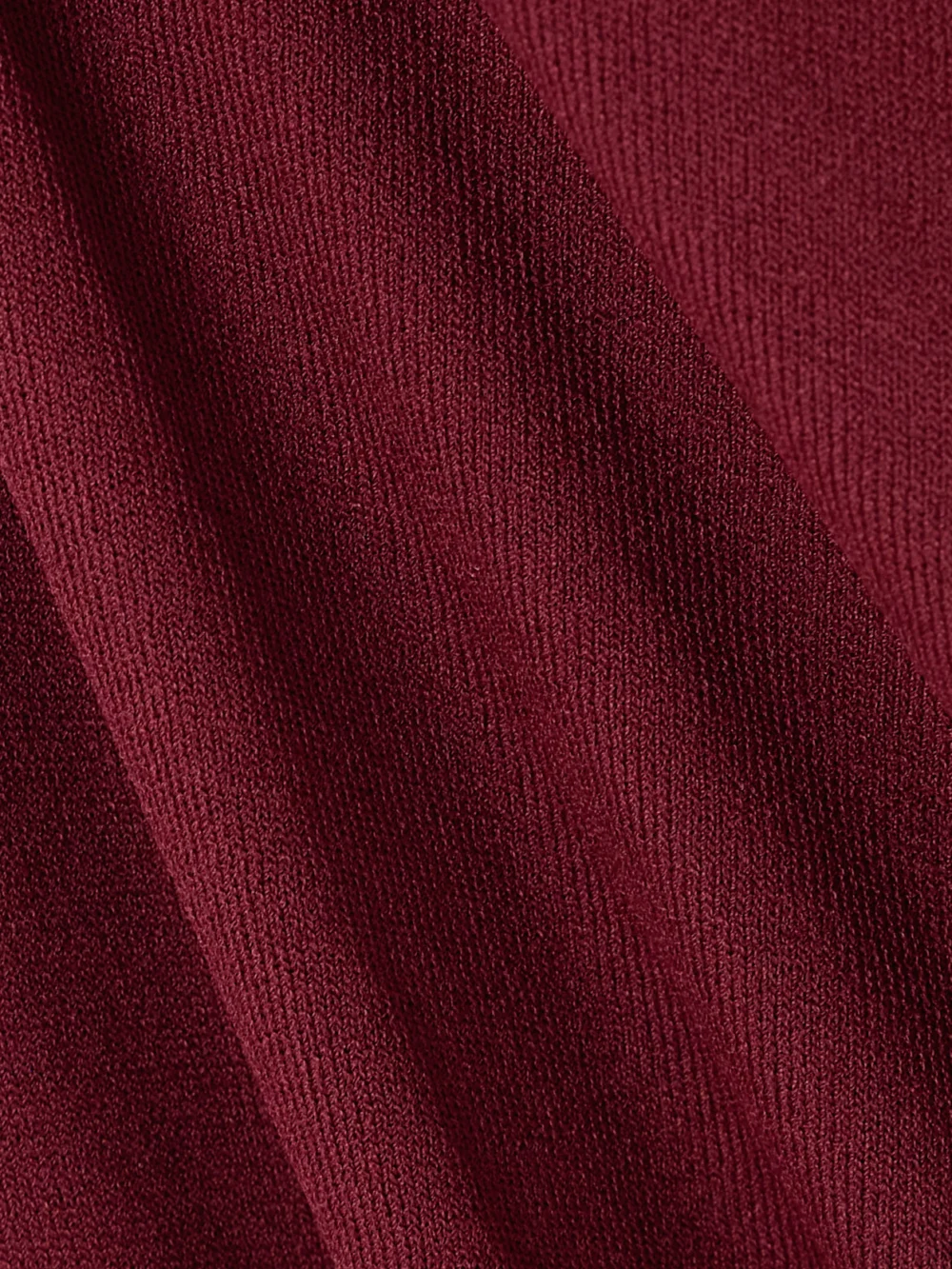 Close-up detail of the Altuzarra Robb Ruched Knitted Midi Dress