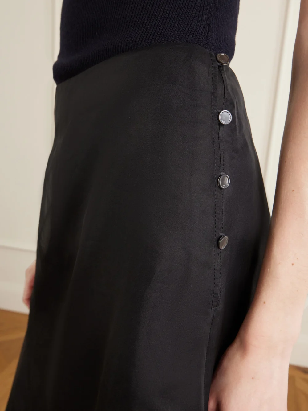 Close-up detail of the Ami Paris Corolla Silk-crêpe De Chine Midi Skirt