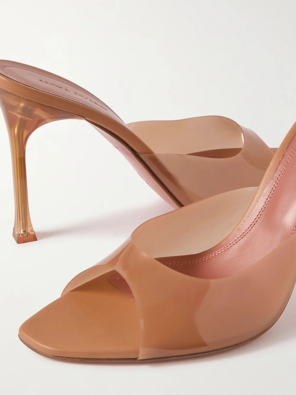 Close-up detail of the Amina Muaddi Alexa 95 Pvc Mules