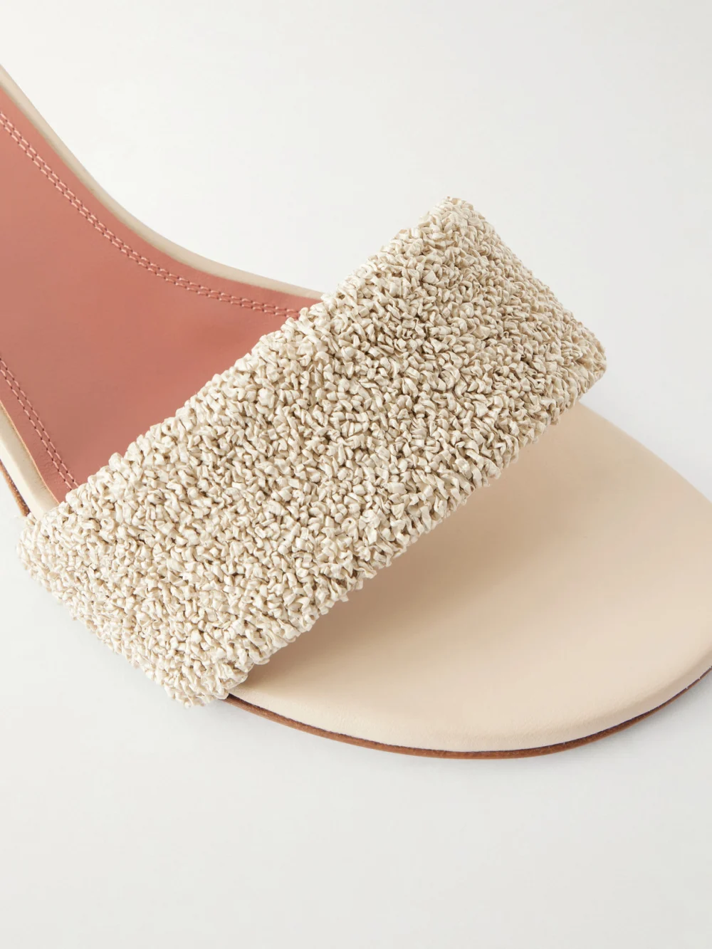 Close-up detail of the Amina Muaddi Andreea 45 Raffia Mules