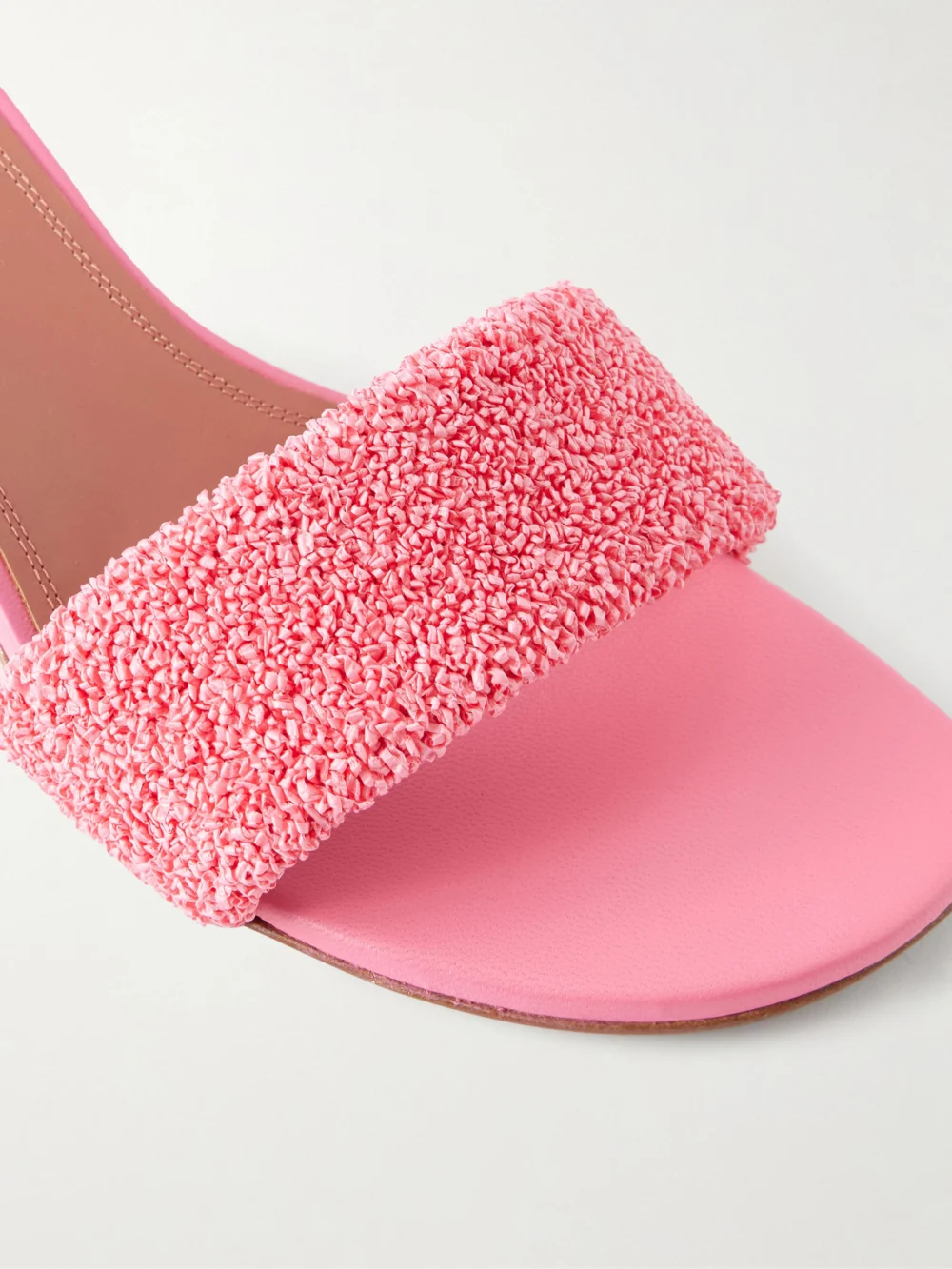 Close-up detail of the Amina Muaddi Andreea 45 Raffia Mules