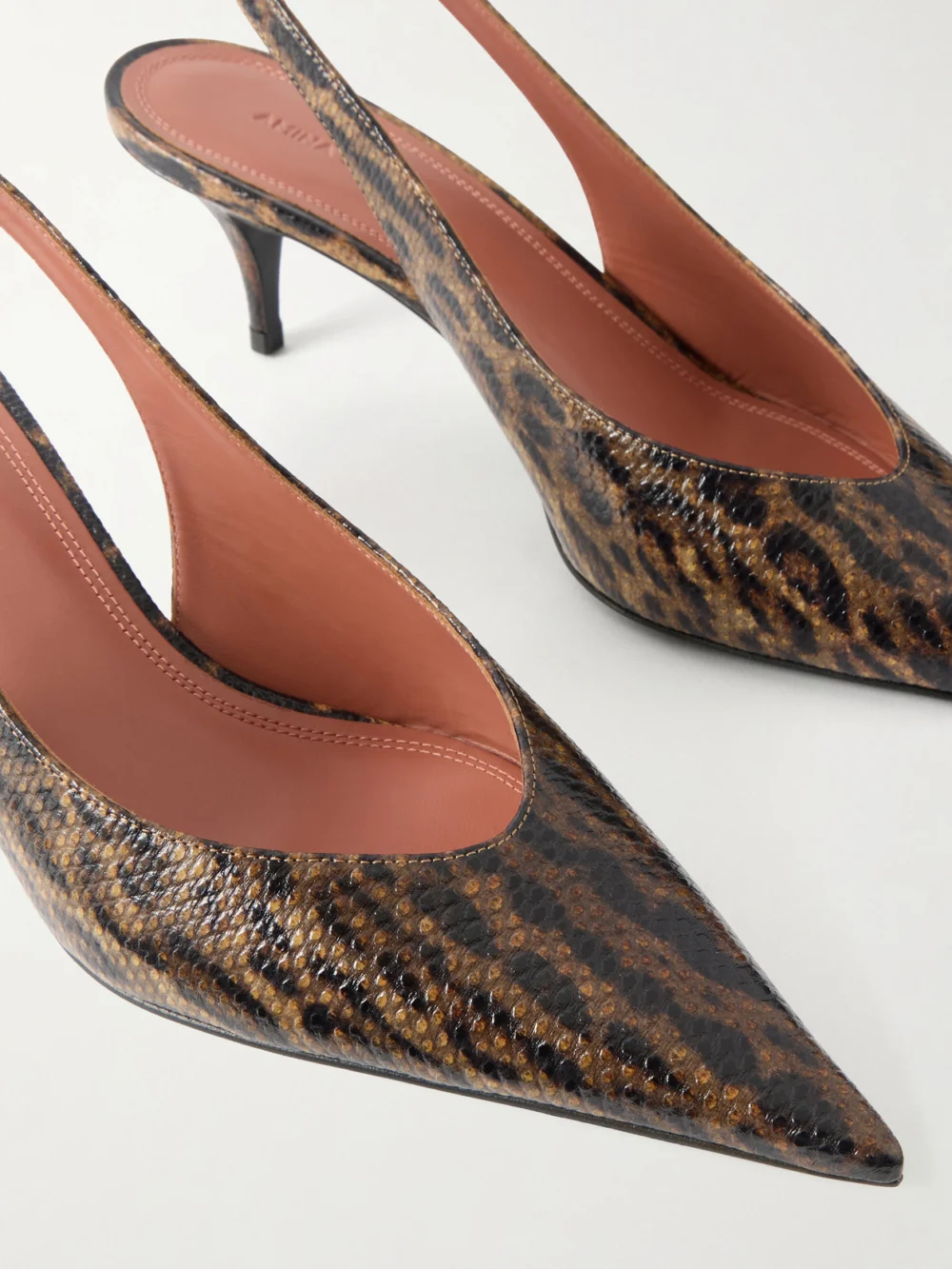 Close-up detail of the Amina Muaddi Anok 55 Snake-embossed Leather Kitten Heel Slingback Pumps